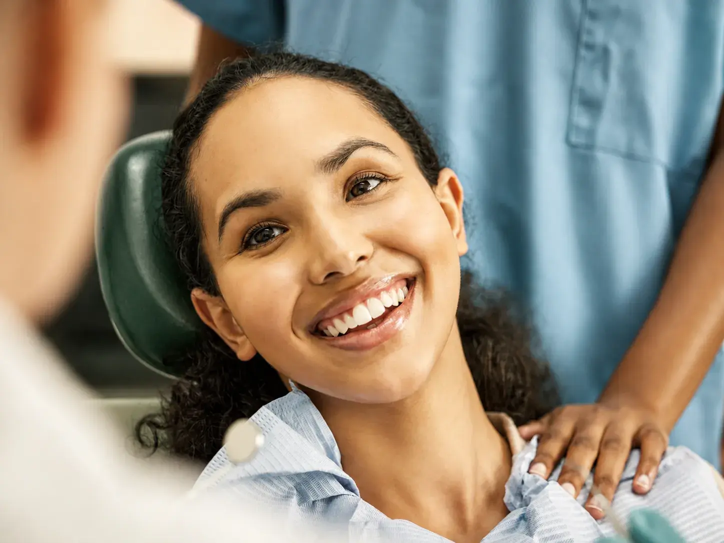 A patient smiling after treatment at East St Kilda Dental