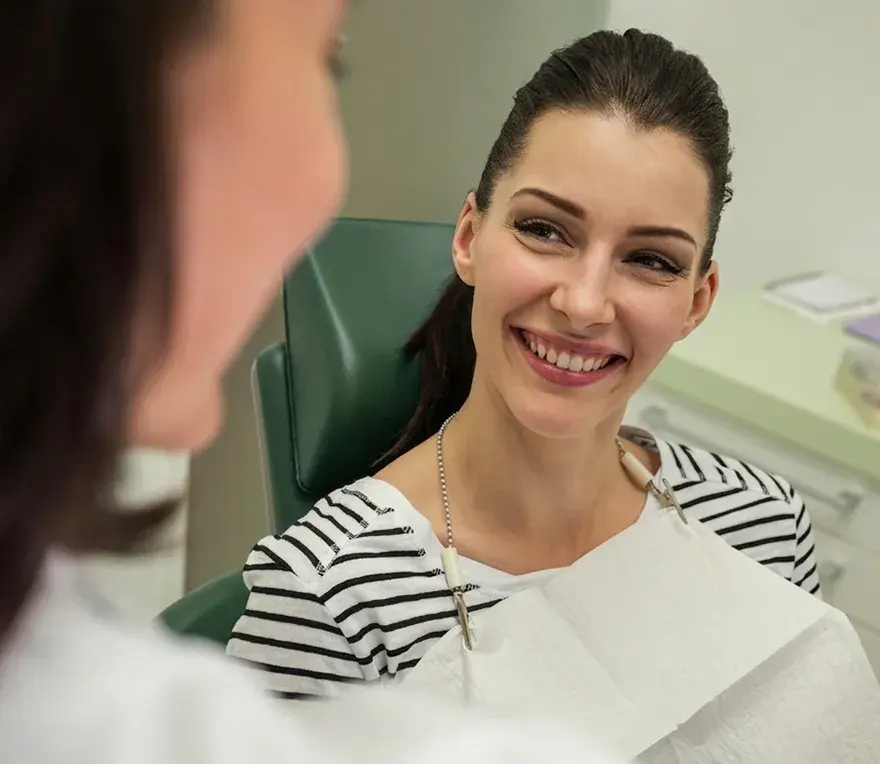 A relaxed patient smiling warmly in the dental chair